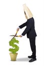 Entrepreneur using scissors to cut money tree Royalty Free Stock Photo