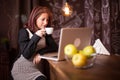 Entrepreneur woman enjoying her coffee in front of her laptop