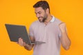 Entrepreneur working with a laptop. Business man man using laptop computer on studio background. Thoughtful caucasian