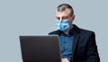 Entrepreneur Working Using Laptop Computer Wearing Protective Mask, Studio Shot Royalty Free Stock Photo