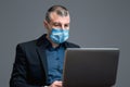 Entrepreneur Working Using Laptop Computer Wearing Protective Mask, Studio Shot Royalty Free Stock Photo