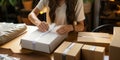 Entrepreneurial packaging Female online business owner diligently prepares a package