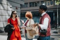 Entrepreneurial team discussing strategy on city street Royalty Free Stock Photo