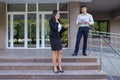 Entrepreneurs, Cute young girl uses phone and boy carries folder Royalty Free Stock Photo