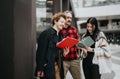 Entrepreneurs discussing work with documents on city street Royalty Free Stock Photo