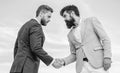 Entrepreneurs shaking hands symbol successful deal. Sure sign you should trust business partner. Men formal suits