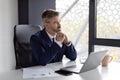 Entrepreneurship Concept. Pensive Handsome Middle Aged Businessman Sitting At Workplace In Office Royalty Free Stock Photo