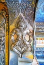 The wall sculpture of Garuda in Silver Temple`s Ubosot, Chiang Mai, Thailand