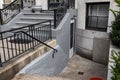 Entry detail of old brownstone apartment building with upper and lower doors