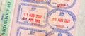 Entry and exit stamps placed in a passport by Cambodia border control officials