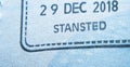 Entry stamp in passport made by immigration officer at border and visa control at Stansted airport in United Kingdom. Selective f