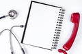 Entry to doctor blank open notebook with stethoscope top view