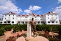 A statue of Mr. Stanley in front of the hedge maze at the Stanley Hotel in Estes Park Colorado