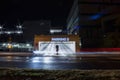 Entry to parking place in night with car trail, long exposure