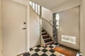 the entryway of a house with a stairwell Royalty Free Stock Photo