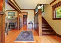 Entryway with wooden staircase and hardwood floor