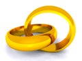 Entwined gold rings on white background