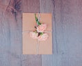 Envelop with white card and rose background. Top view., Envelope with flowers summer, spring.