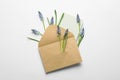 Envelope with beautiful spring muscari flowers and card Royalty Free Stock Photo