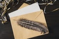 Envelope with a blank letter and pen on a wooden table. Tinsel, holiday mood