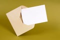 Envelope with blank note card or letter, front view, white copy space Royalty Free Stock Photo