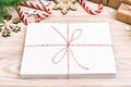 Envelope with blank sheet of paper on Christmas background - fir branch, pine cones, red ribbon, star and heart of Royalty Free Stock Photo