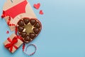 Envelope on colored background for Valentine Day with gift box and chocolate. Heart shaped with gift box of chocolates Royalty Free Stock Photo