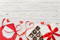 Envelope on colored background for Valentine Day with gift box and chocolate. Heart shaped with gift box of chocolates Royalty Free Stock Photo