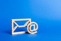 Envelope and email symbol on a blue background. Concept email address. Internet technologies and contacts for communication. Royalty Free Stock Photo