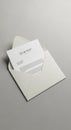 Envelope with flap slightly open, containing a plain white sheet of paper. The paper Royalty Free Stock Photo