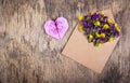 Envelope with flowers. Wildflowers in an envelope. Heart of origami. Royalty Free Stock Photo