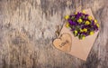 Envelope with flowers. Wildflowers in an envelope. Heart made of wood. Romantic concept. Royalty Free Stock Photo