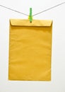 Envelope and green clothespin Royalty Free Stock Photo