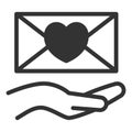 Envelope with a heart in the palm of a woman_1 Royalty Free Stock Photo