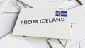 Envelope with From Iceland text on pile of other envelopes. International mail related conceptual 3D rendering