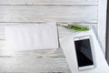 Envelope with a letter on the desktop. Knife, notebook and mobile phone. Royalty Free Stock Photo