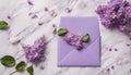 envelope lilac for wedding invitation on marble background with flowers Royalty Free Stock Photo