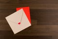 Envelope Love Letter. Tow Envelopes Red and Brown with a Heart on Wood Pattern