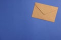 Envelope made of parchment paper on blue background, top view. Space for text