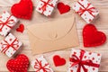 Envelope Mail with Red Heart and gift box over Orange Wooden Background. Valentine Day Card, Love or Wedding Greeting Concept Royalty Free Stock Photo