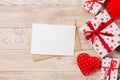 Envelope Mail with Red Heart and gift box over Orange Wooden Background. Valentine Day Card, Love or Wedding Greeting Concept Royalty Free Stock Photo