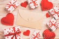 Envelope Mail with Red Heart and gift box over Orange Wooden Background. Valentine Day Card, Love or Wedding Greeting Concept Royalty Free Stock Photo