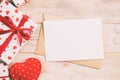 Envelope Mail with Red Heart and gift box over Orange Wooden Background. Valentine Day Card, Love or Wedding Greeting Concept Royalty Free Stock Photo