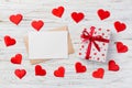 Envelope Mail with Red Heart and gift box over White Wooden Background. Valentine Day Card, Love or Wedding Greeting Concept Royalty Free Stock Photo