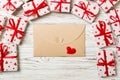 Envelope Mail with Red Heart and gift box over Wooden Background. Valentine Day Card, Love or Wedding Greeting Concept design Royalty Free Stock Photo