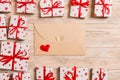 Envelope Mail with Red Heart and gift box over Wooden Background. Valentine Day Card, Love or Wedding Greeting Concept design Royalty Free Stock Photo