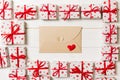 Envelope Mail with Red Heart and gift box over Wooden Background. Valentine Day Card, Love or Wedding Greeting Concept design Royalty Free Stock Photo