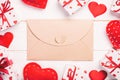 Envelope Mail with Red Heart and gift box over Wooden table Background. Valentine Day Card, Love or Wedding Greeting Concept Royalty Free Stock Photo