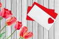 Envelope Mail and Red Tulips, Over White Wooden Background Royalty Free Stock Photo