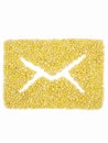 Envelope, mail sign from grain of millet on isolated white background. Royalty Free Stock Photo